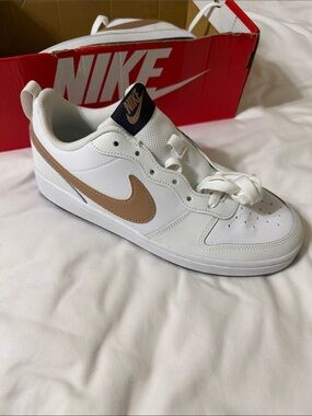 Nike White Low-Top Sneaker with Tan Swoosh and Black Tongue Tag